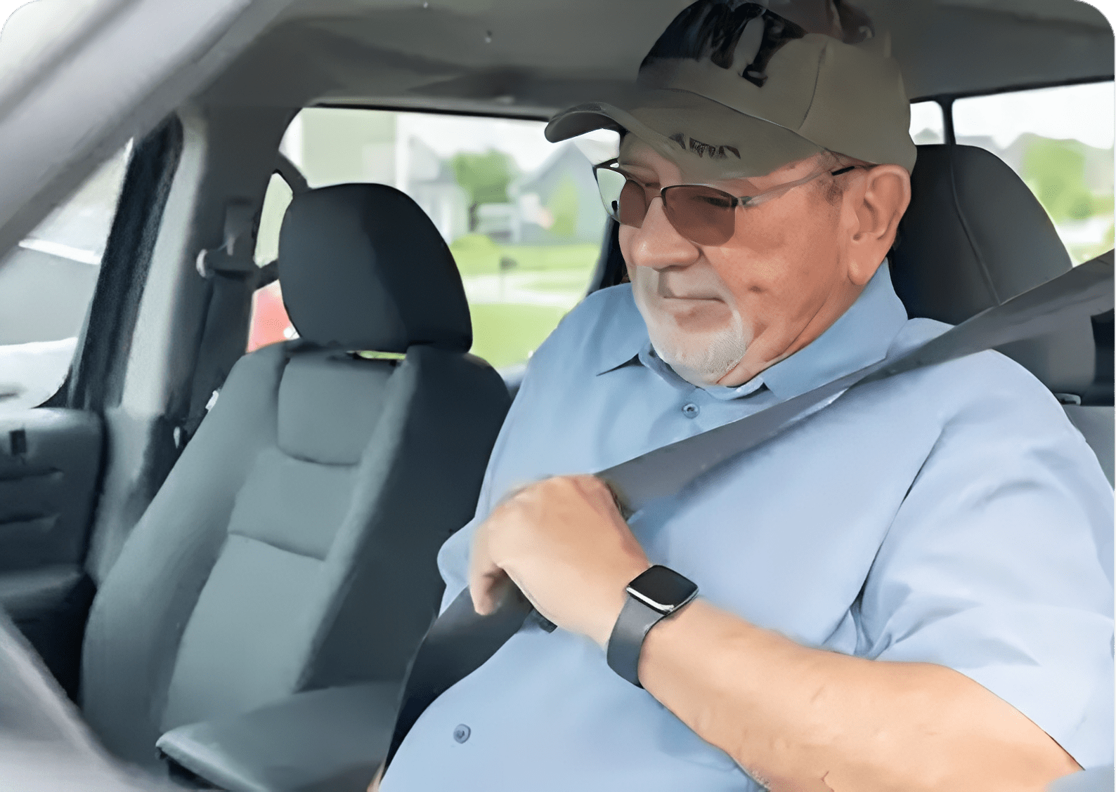 Man wearing cap fastens seatbelt